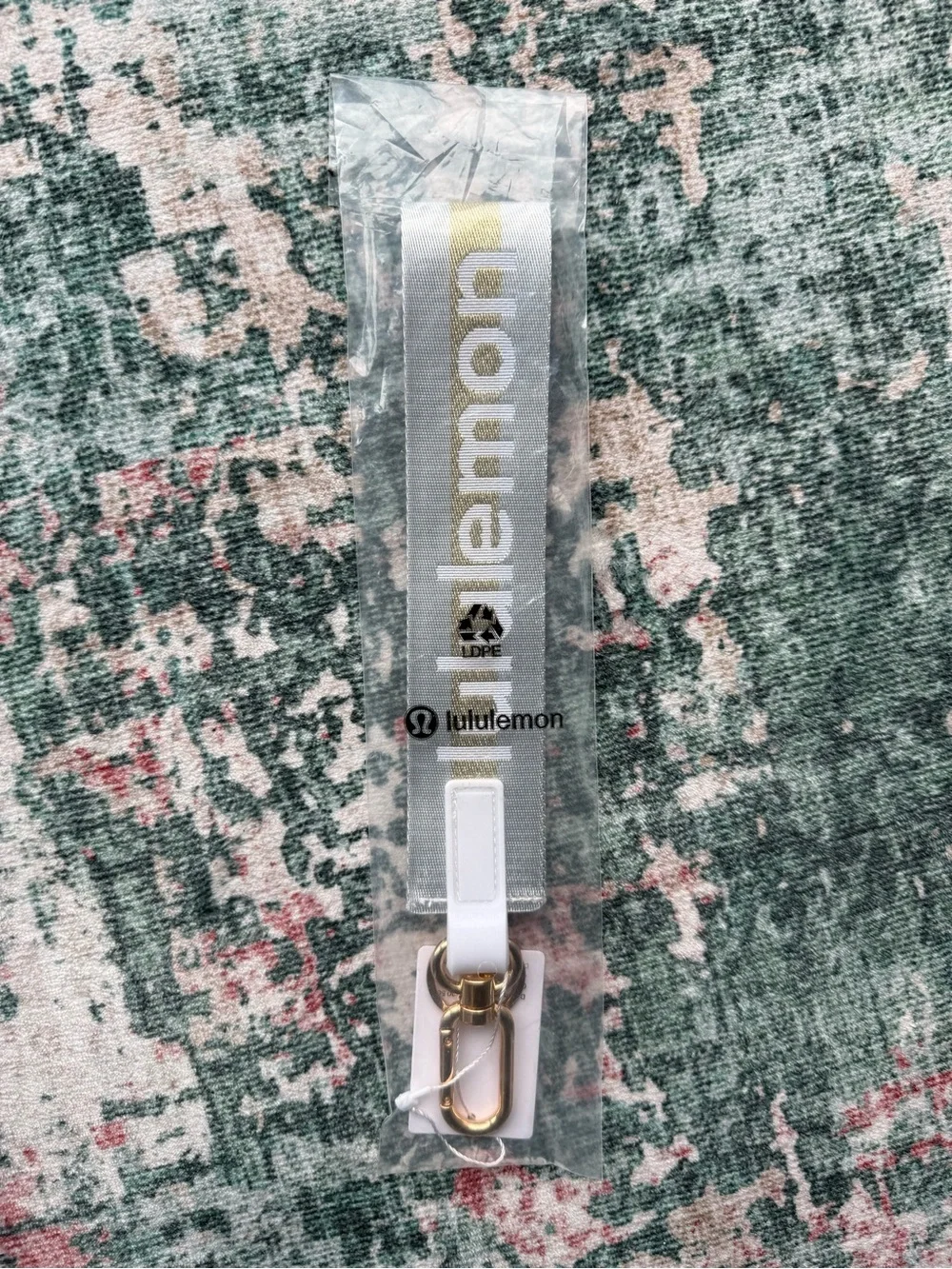 lululemon athletica Never Lost Keychain Lanyard in light grey with Gold Logo